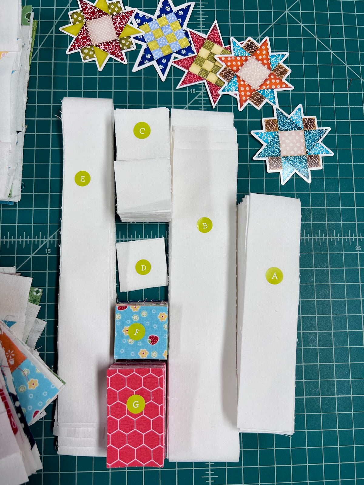 Green letter stickers for quilt sewing pieces on fabric and quilt blocks