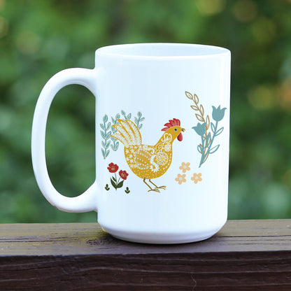 Chicken and rooster theme all white ceramic mug with floral designs in blue, yellow, and red.