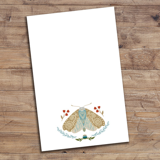 Floral Moth notepad on wood background