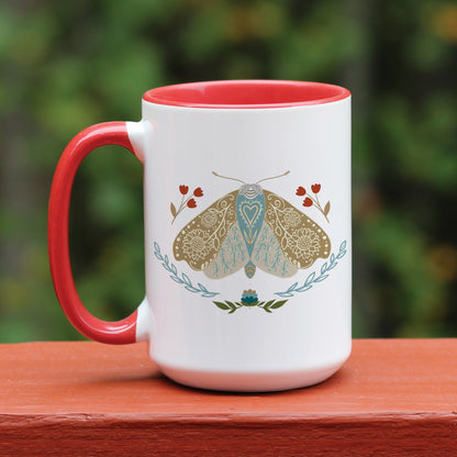 Boho floral moth mug personalized with name. The mug has a red handle.