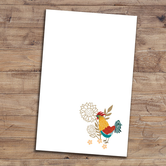 Floral rooster notepad on wood background