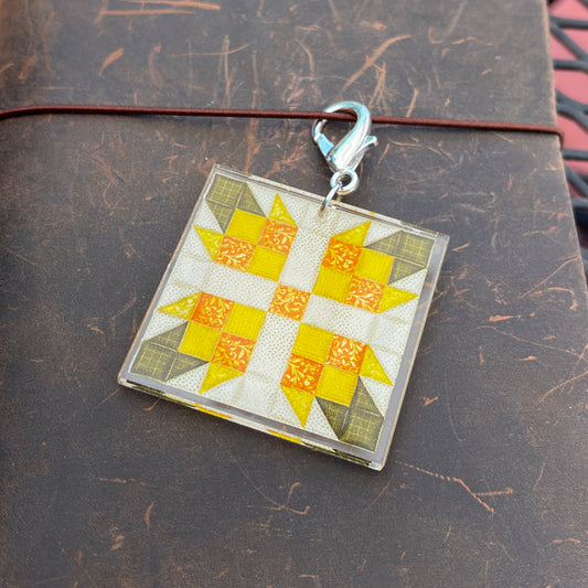 Journal charm with yellow flower quilt block design on leather journal
