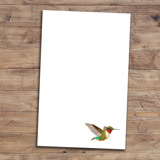 Hummingbird notepad on wood background