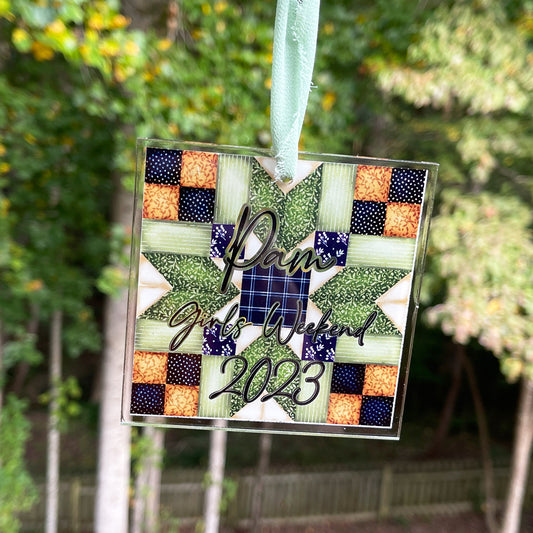 Personalized quilt block Christmas ornament with chiffon ribbon. Blue, greens,and browns.