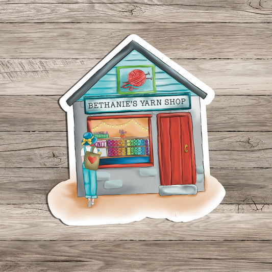 Personalized Yarn Shop 3x3 inches sticker decal on wood background.