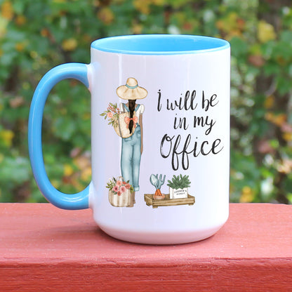 Garden I will be in my office with girl gardener and plants on a white mug with blue handle.