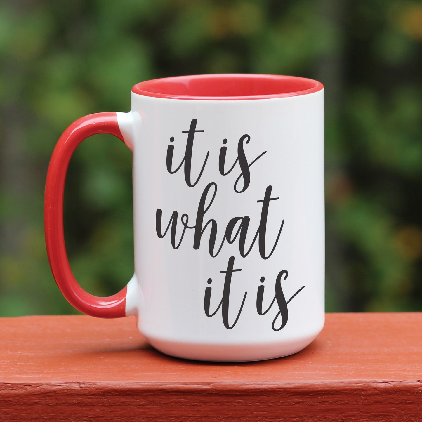 It is what it is white coffee mug with red handle.