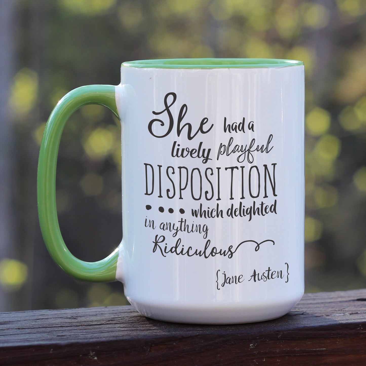 Jane Austen Pride and Prejudice quote white coffee mug with green handle.