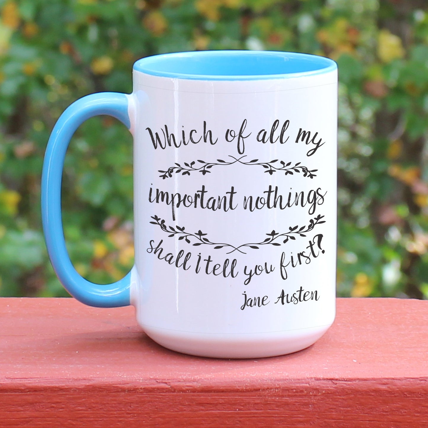 Jane Austen Pride and Prejudice quote white coffee mug with blue handle.