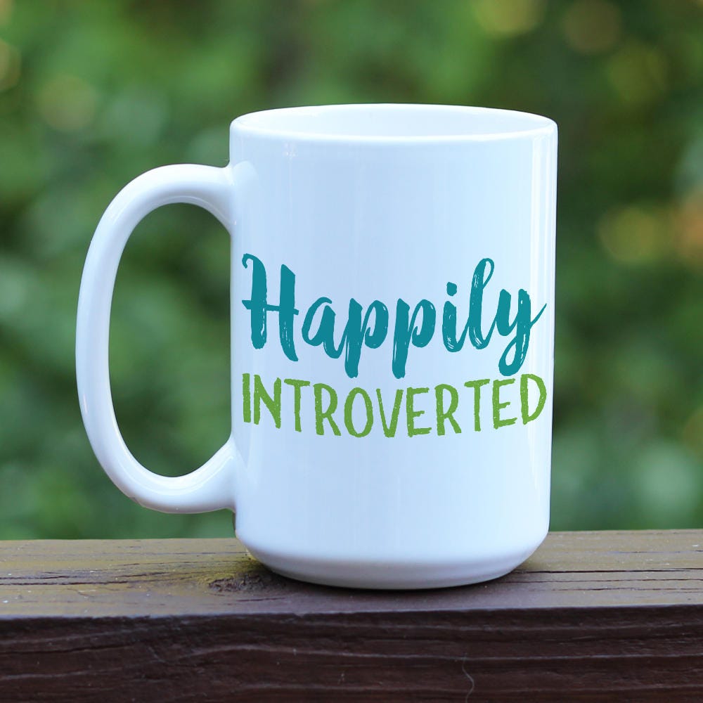 Happily Introverted ceramic coffee mug with white handle