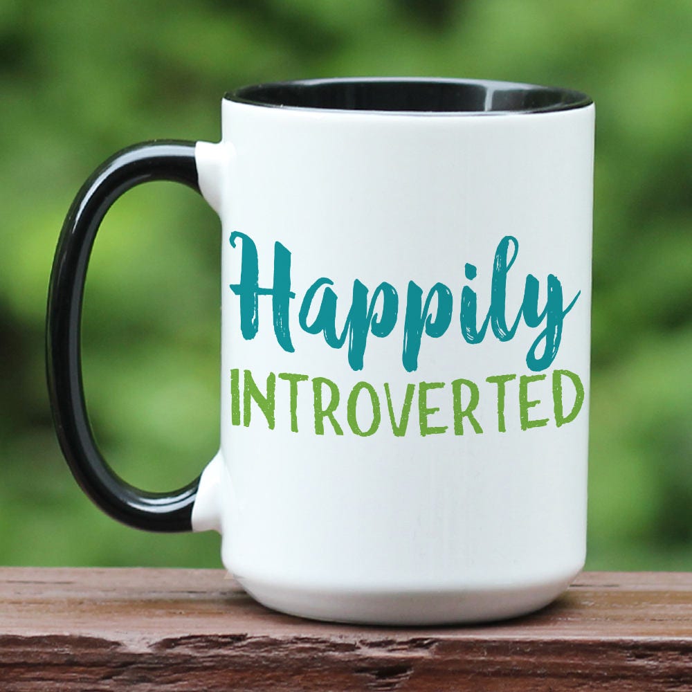 Happily Introverted ceramic coffee mug with black handle