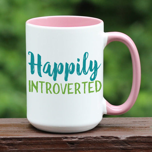 Happily Introverted ceramic coffee mug with pink handle