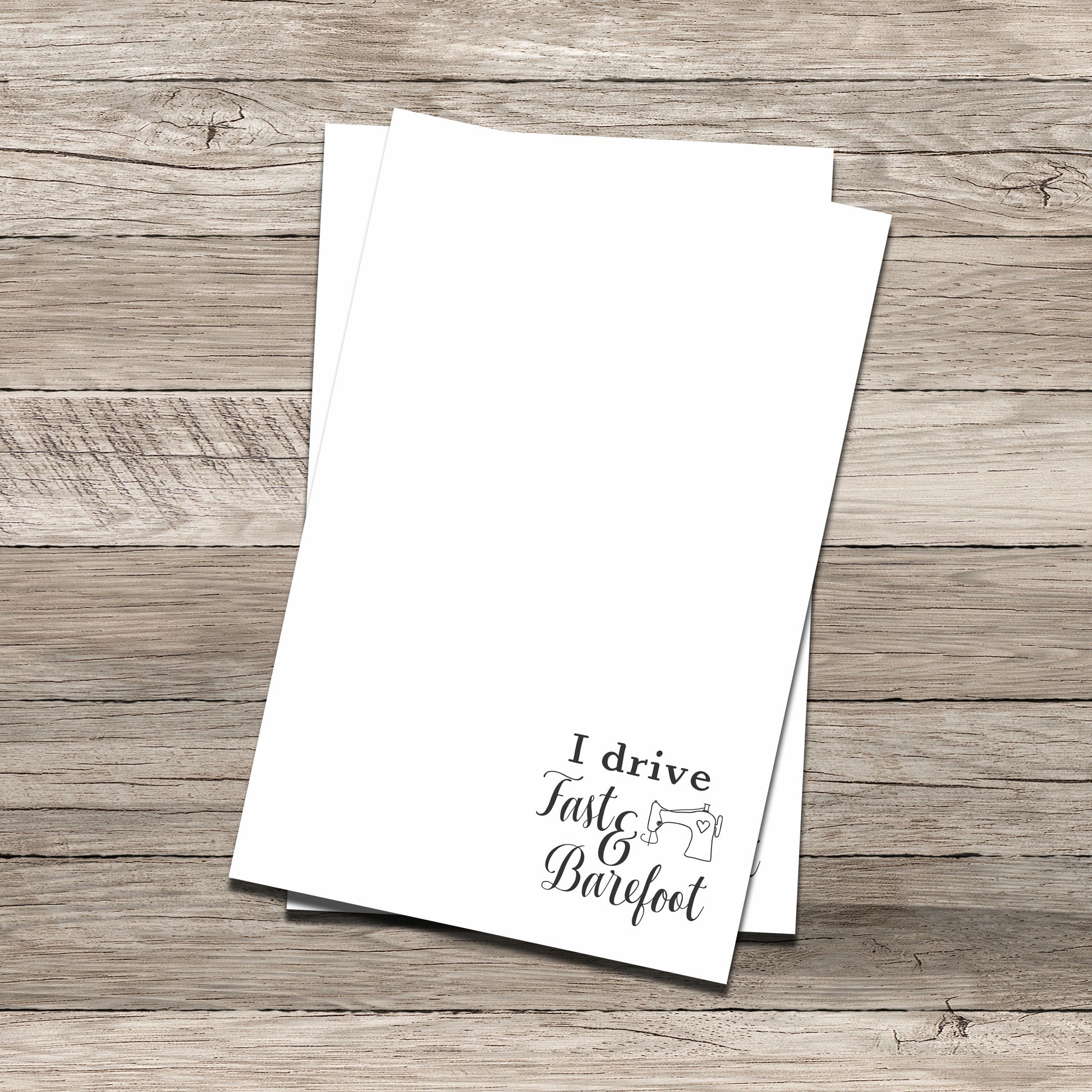 Personalized notepad set featuring a sewing-themed phrase at the bottom that reads 'I drive Fast & Barefoot' with a sewing machine illustration, printed on a white background with a wood-textured backdrop.