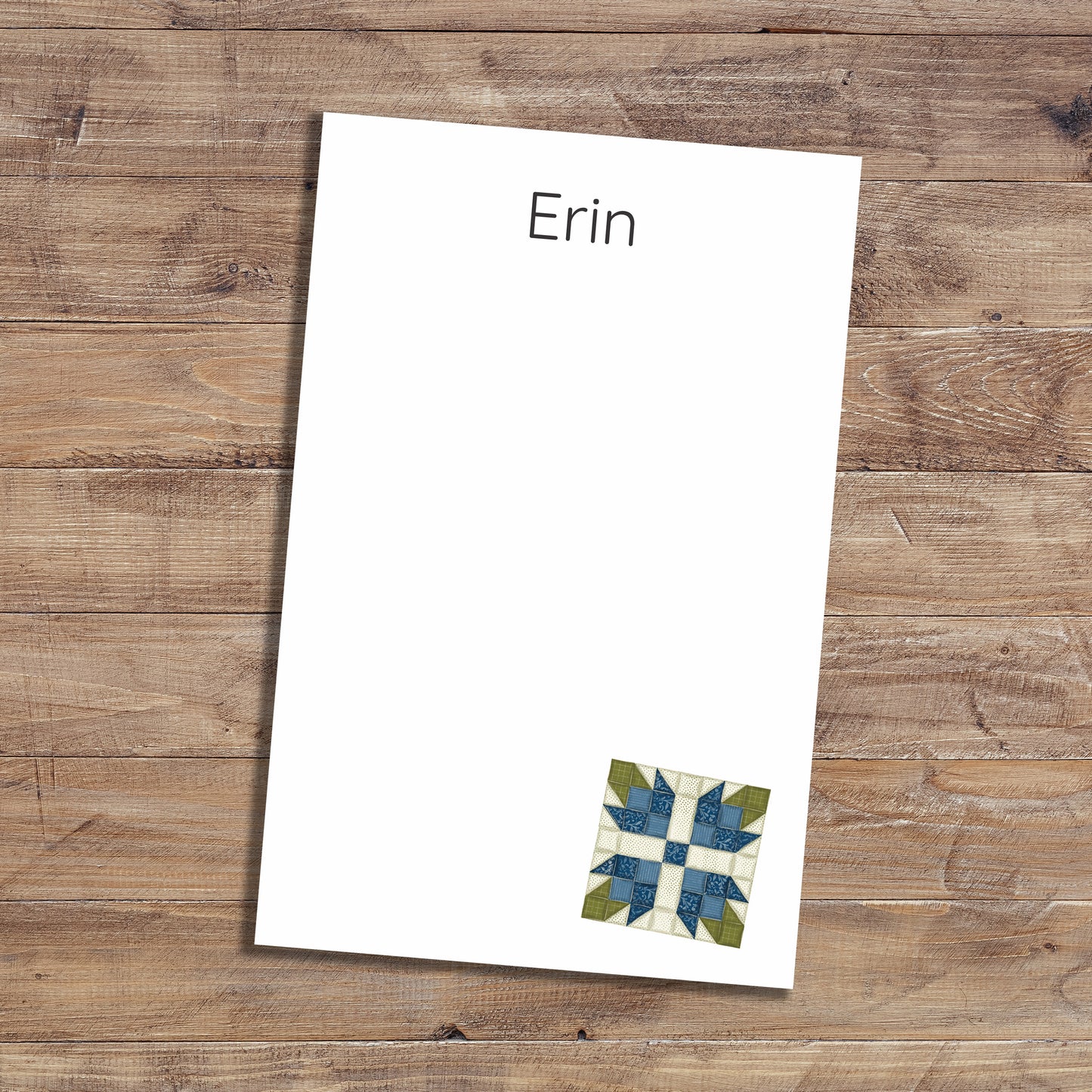 Personalized notepad with blue tea rose quilt block design.