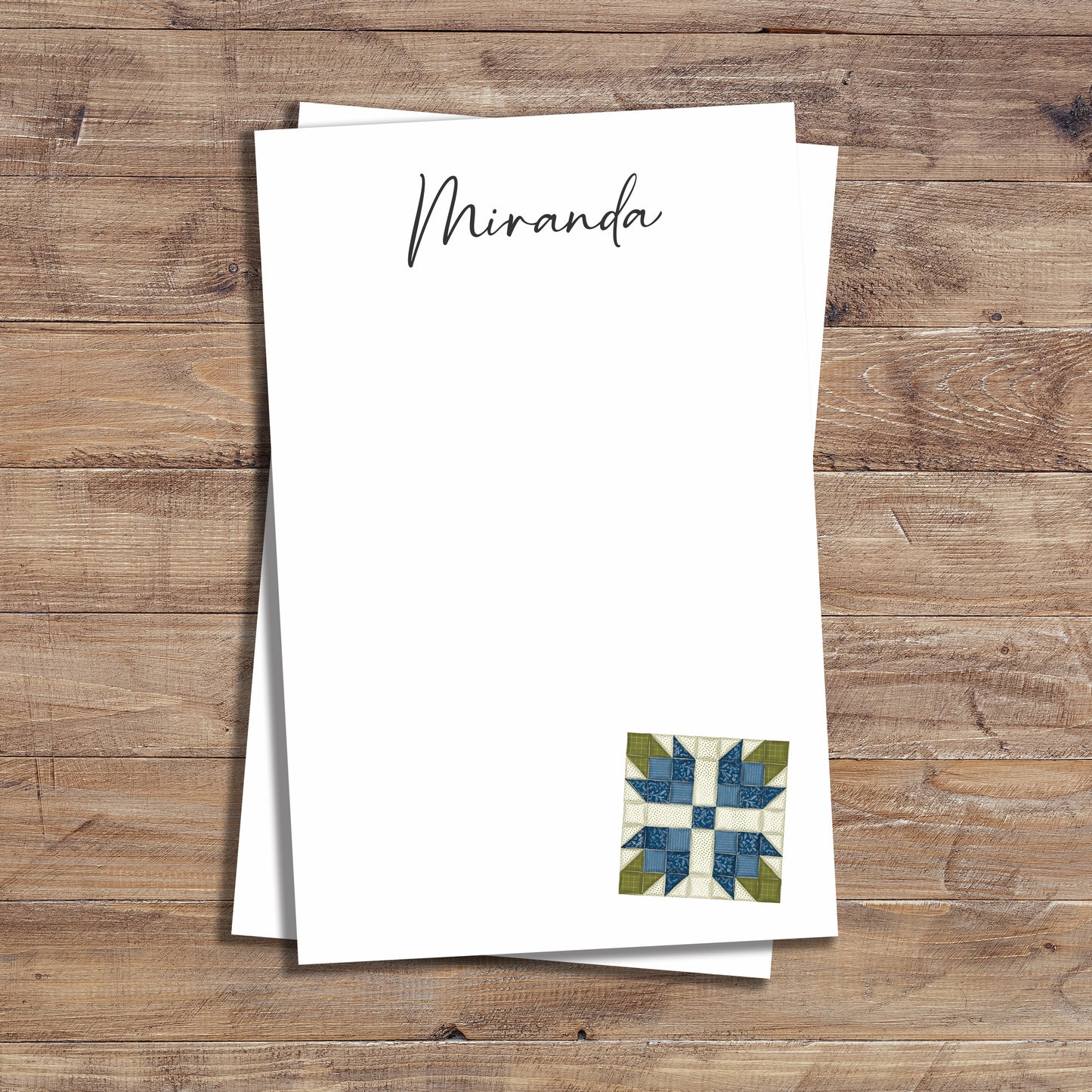 Personalized notepad with blue tea rose quilt block design.