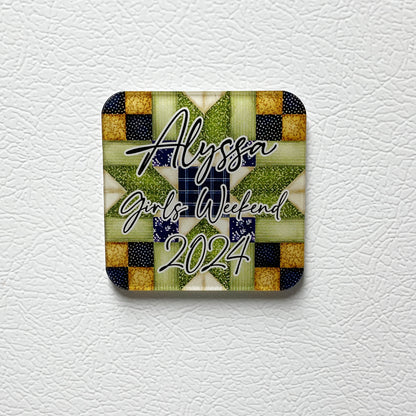 Blue and green square acrylic magnet with quilt patterns and personalized text that says "Alyssa Girls Weekend 2024."