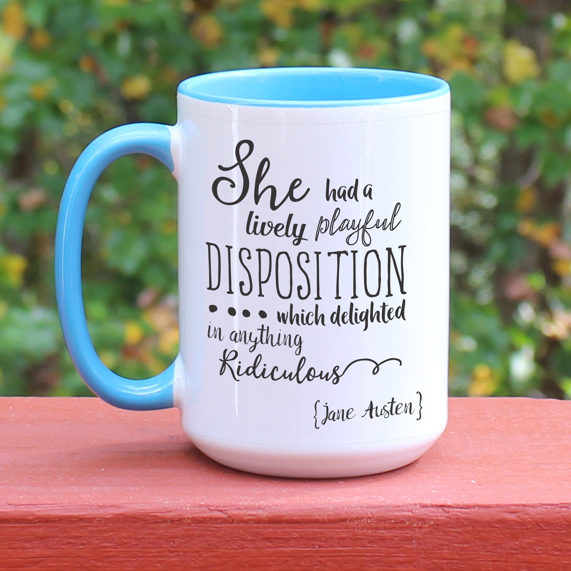 Jane Austen Pride and Prejudice quote white coffee mug with blue handle.