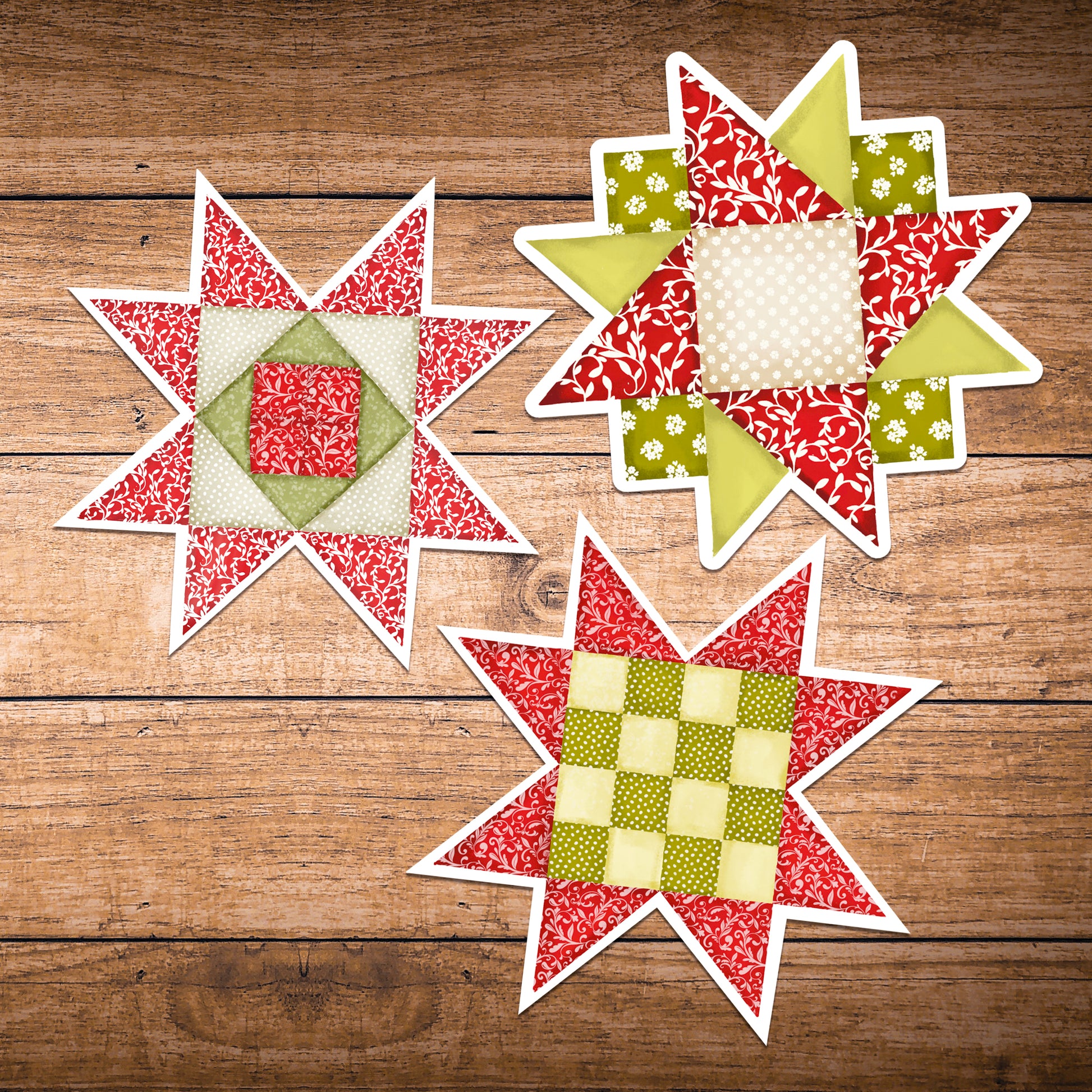 Set of three red and green quilt block stickers laying on dark wood.