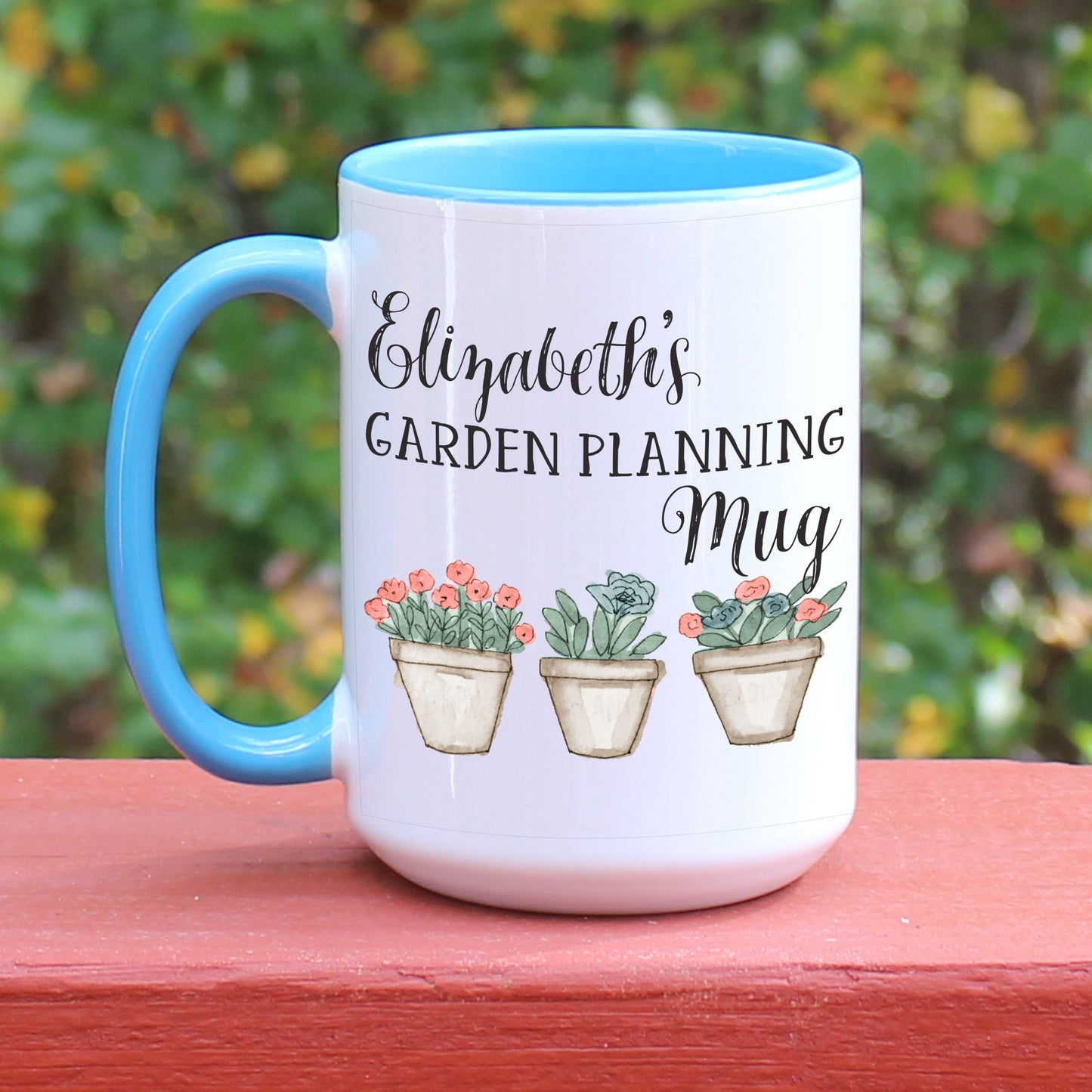 Personalized Garden Planning mug with blue handle.