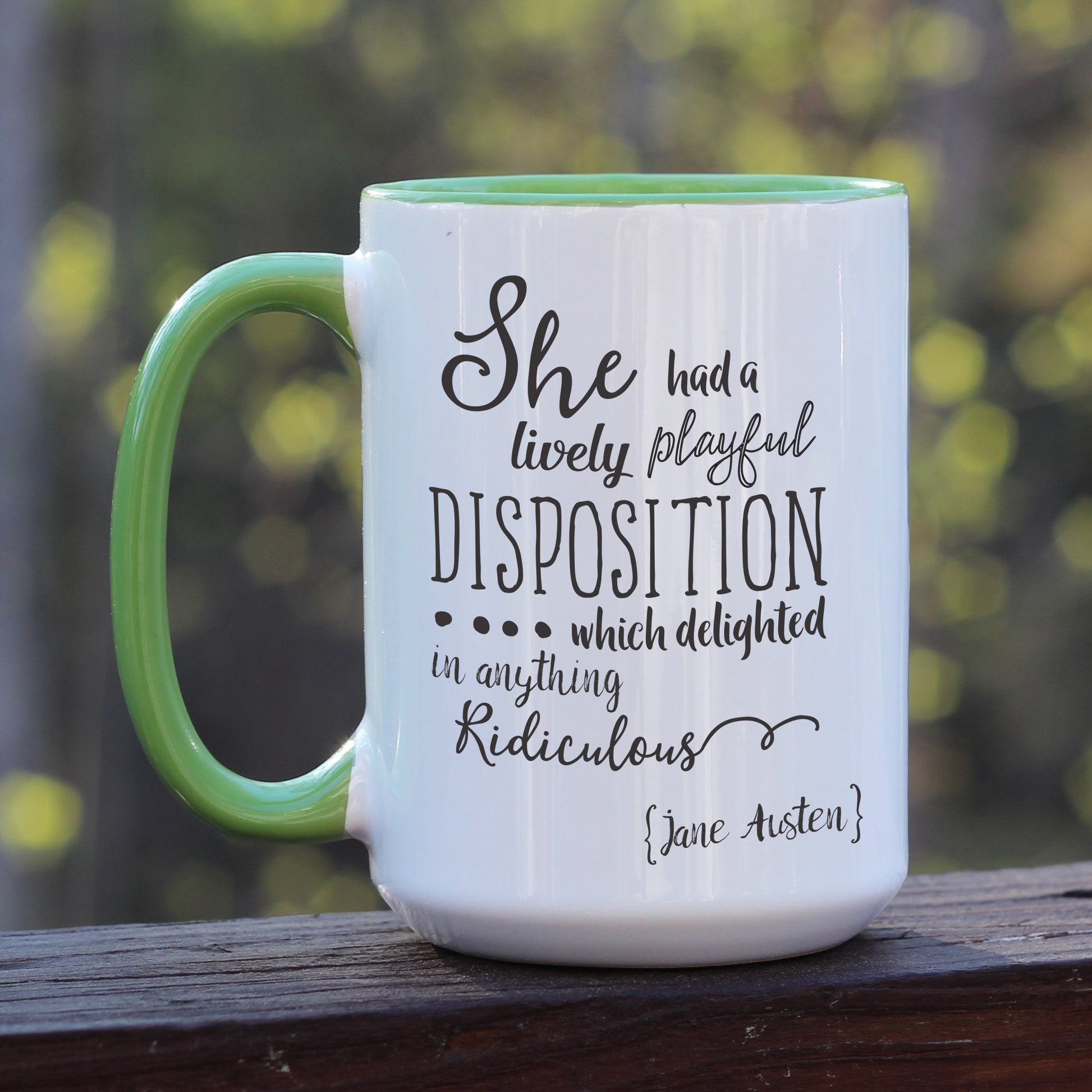 Jane Austen Pride and Prejudice quote white coffee mug with green handle.