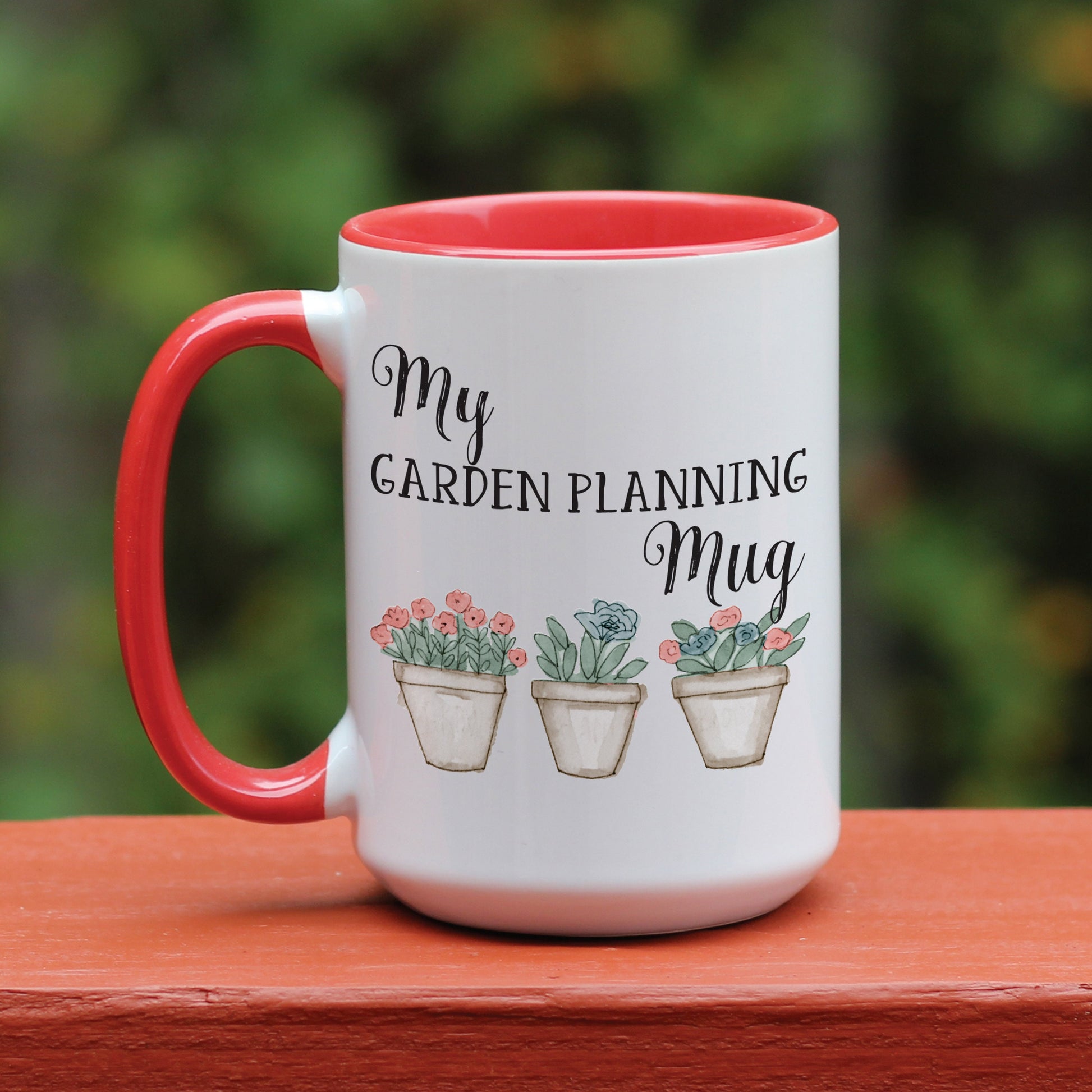 Personalized Garden Planning mug with red handle.